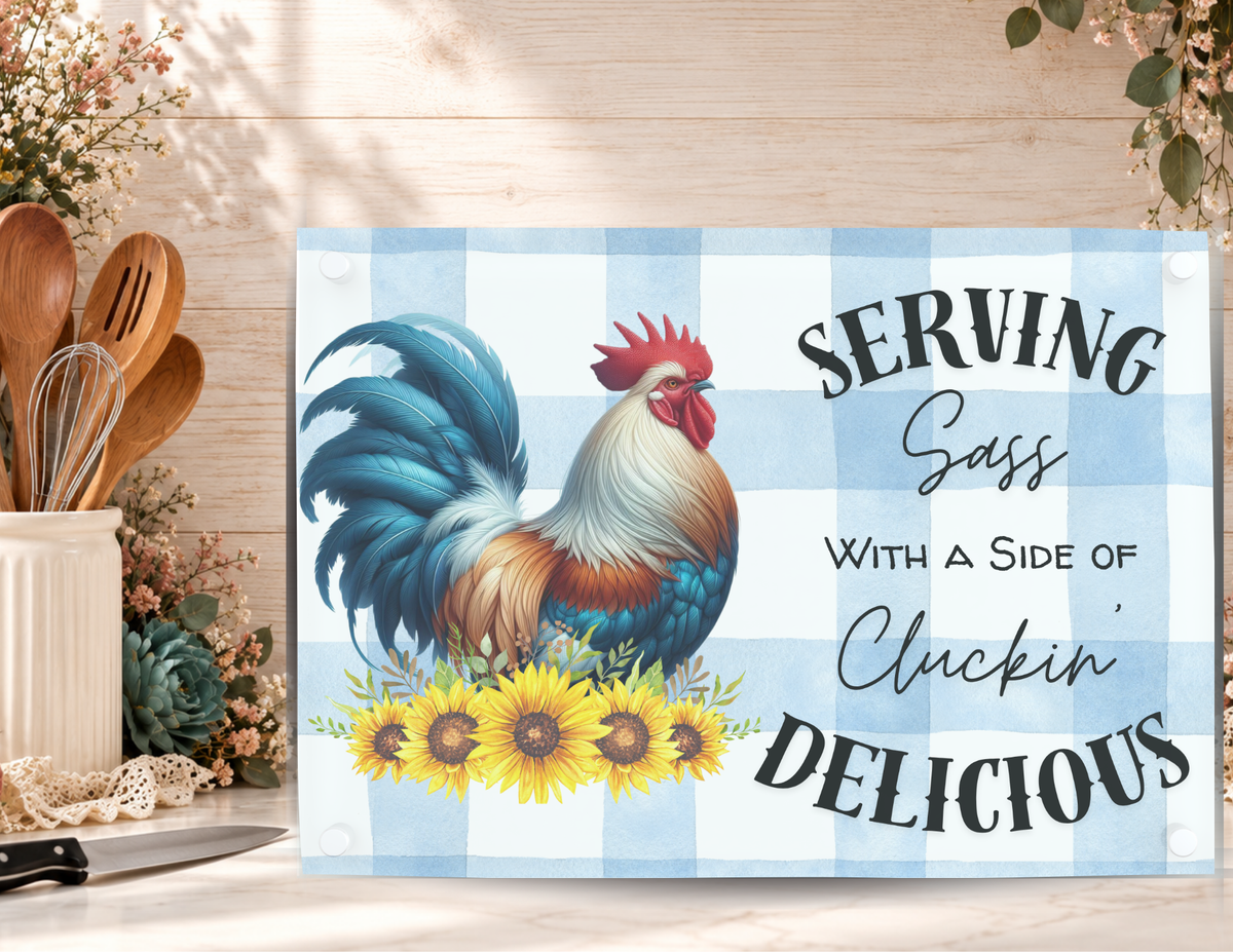 Serving Sass tempered glass cutting board with a colorful rooster and sunflowers displayed with a kitchen knife and utensils