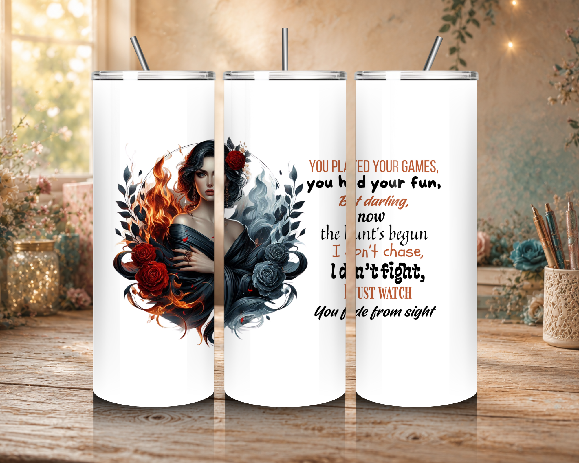 The Huntress 20 oz tumbler design featuring a dark-haired woman surrounded by red and black roses, fire, smoky shadows, and a powerful warning quote.
