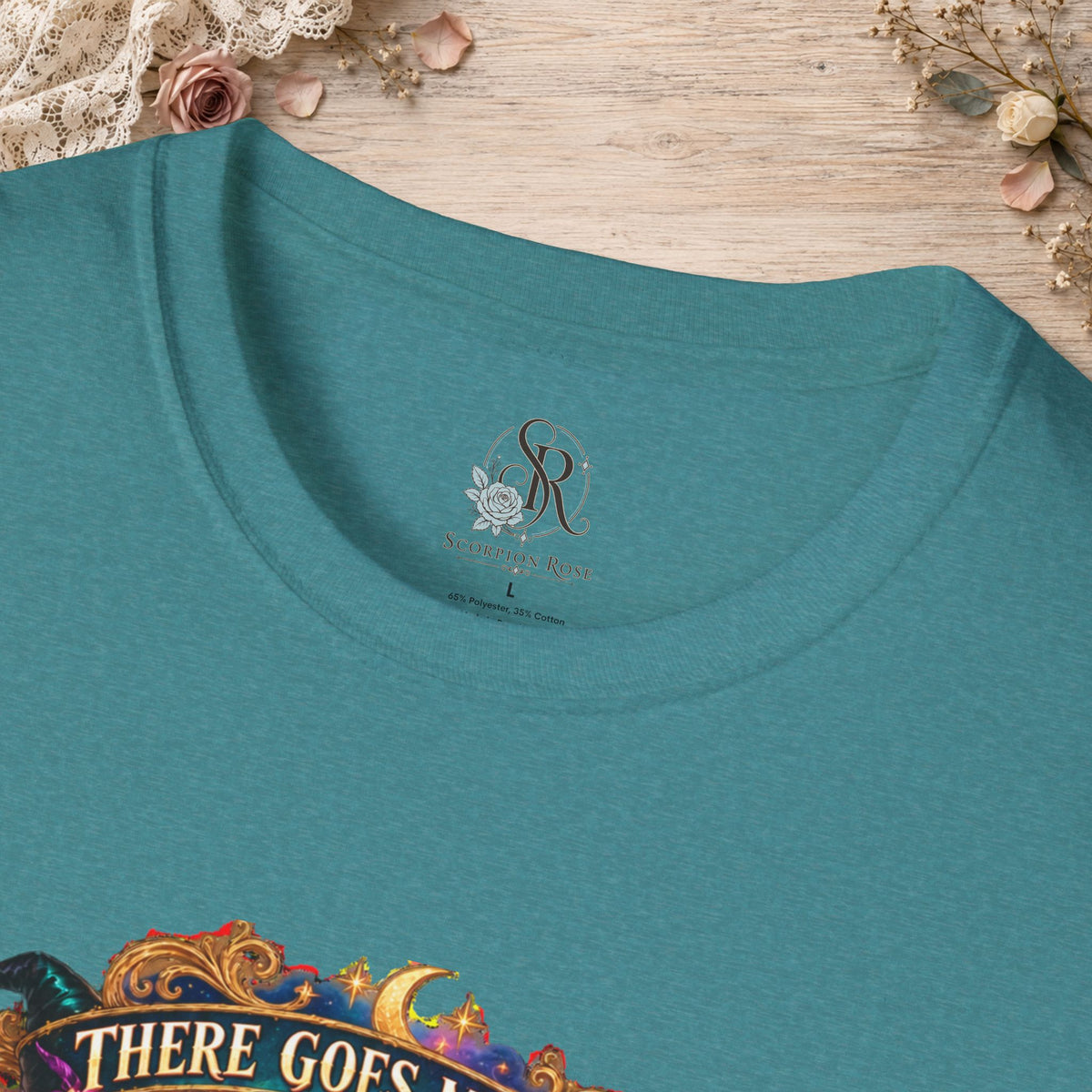 Collar and print detail of the Heather Galapagos Blue There Goes My Last Flying Fuck witch T-shirt